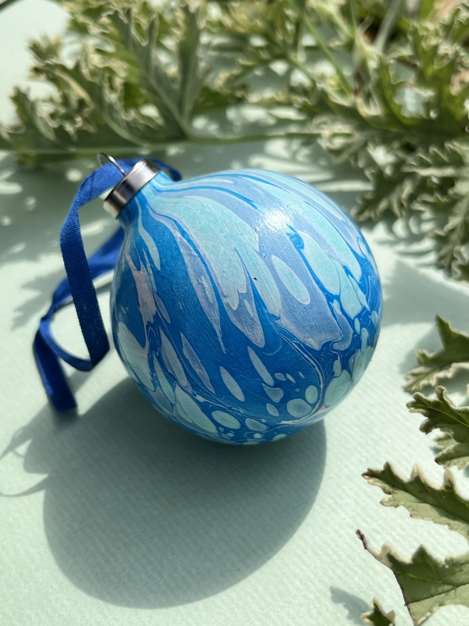 Hand-marbled round ceramic Christmas bauble