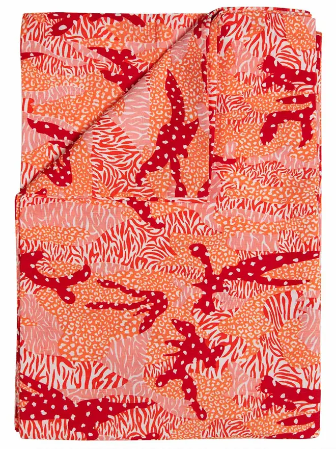 Orange Big Cat Camo Duvet Cover And Pillowcase, a red duvet and pillowcase sitting on a bed together. 