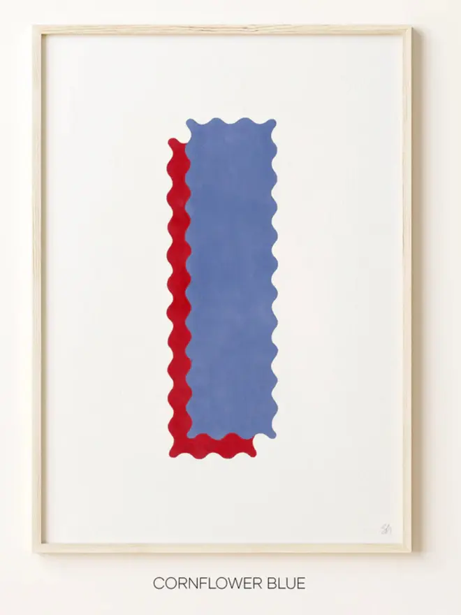 Framed wall art print featuring a large decorative letter “I” in blue tones with a ric rac–style wavy edge design, centered on a white background. 