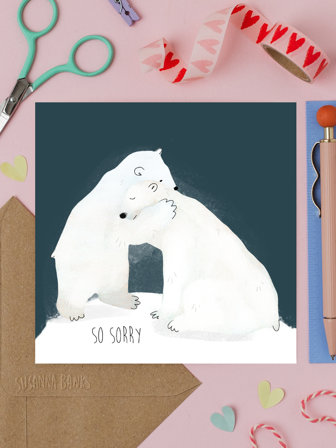 'so sorry' illustrated empathy card. card featuring two illustrated polar bears hugging.