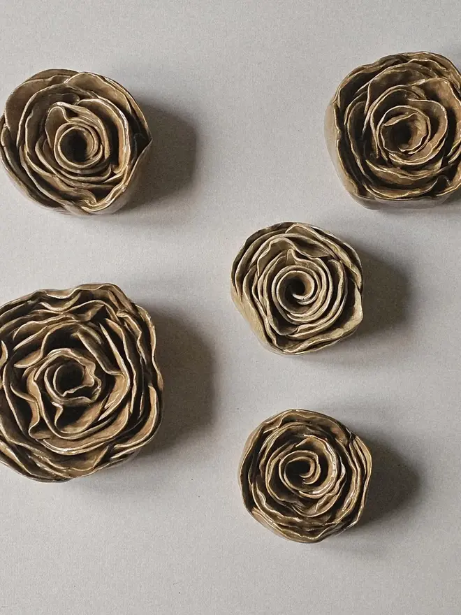 caramel tan camel brown handmade ceramic rose sculpture with a glossy glaze, crafted in 3D and designed to hang on a wall