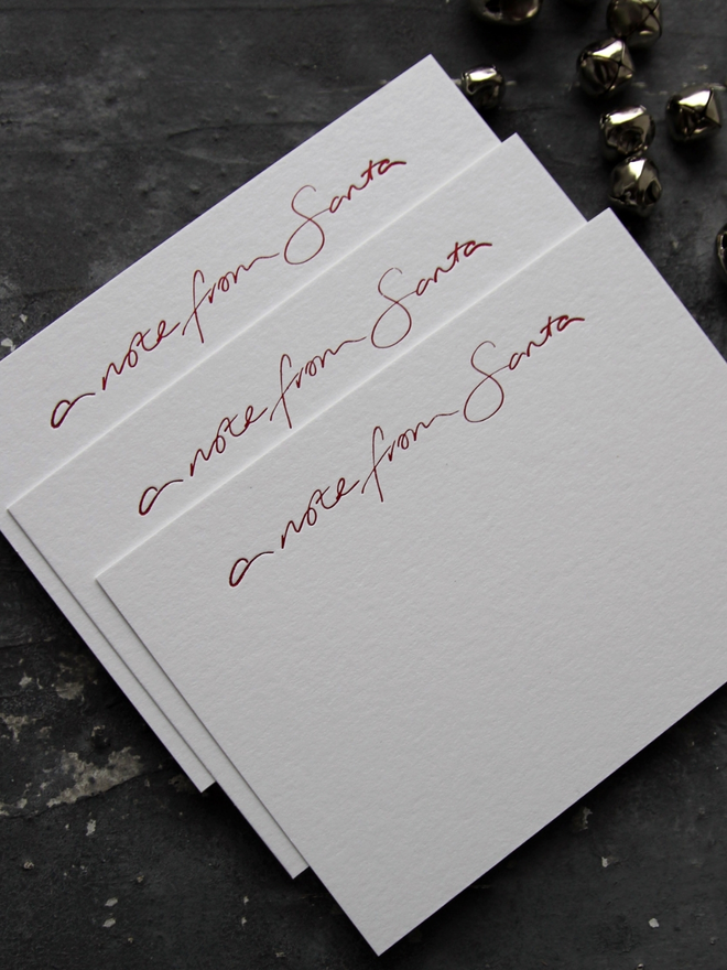 Notecards hand foiled in red says A Note From Santa with an envelope that says North Pole Mail