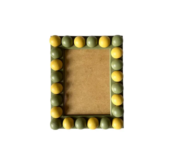 green and yellow wood bobbin frame