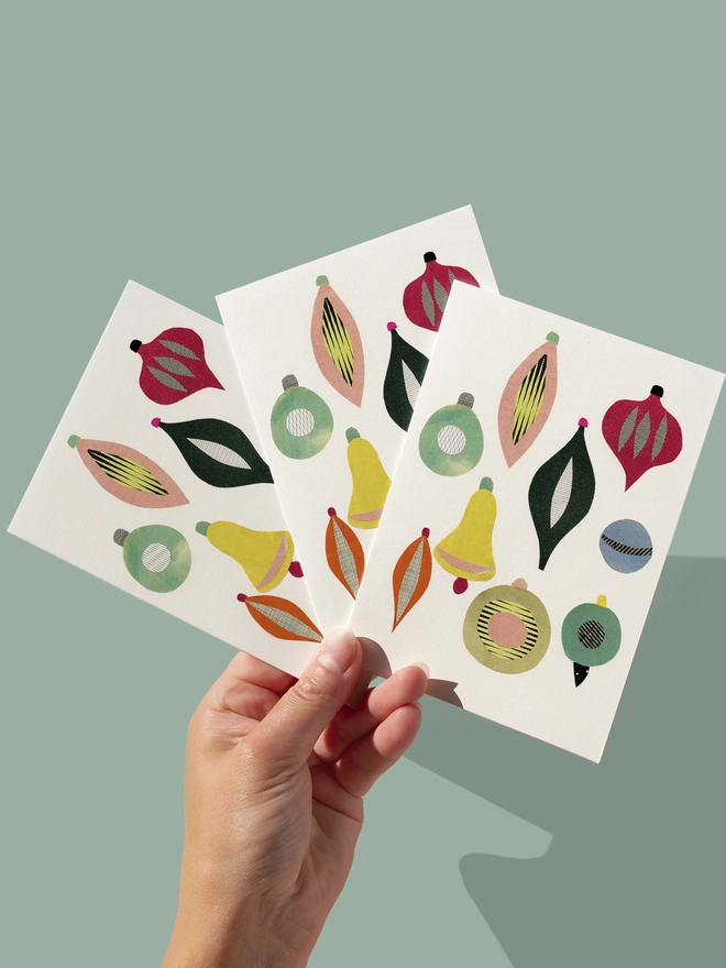 A Christmas card featuring a collection of colourful mid century baubles.