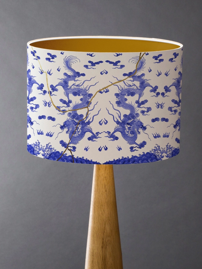 Drum Lampshade blue and white kintsugi inspired featuring Japanese dragons with a gold inner on a wooden base 