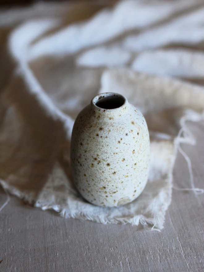 Stoneware bud vase. A small stoneware handmade bud vase with a speckled glaze