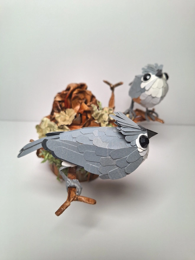 Tufted Titmice on a trees tump handmade bird sculpture