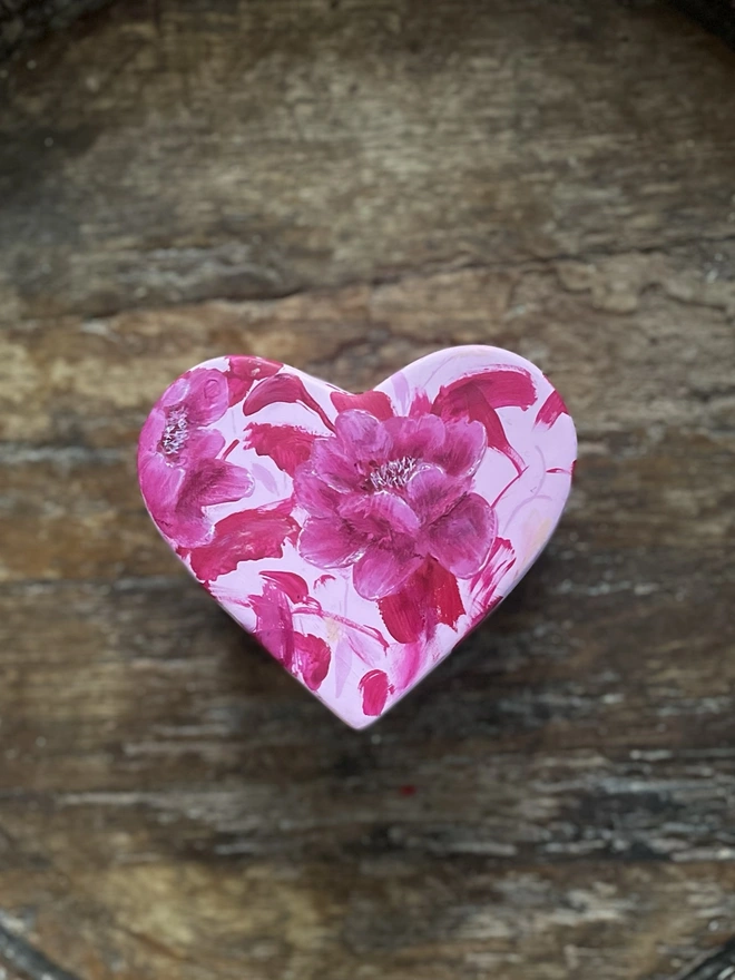 A beautifully hand painted floral ceramic heart shaped jewellery/ keepsake box background painted in a pale pink and pink peony flowers inspired by Toile De Jouy.