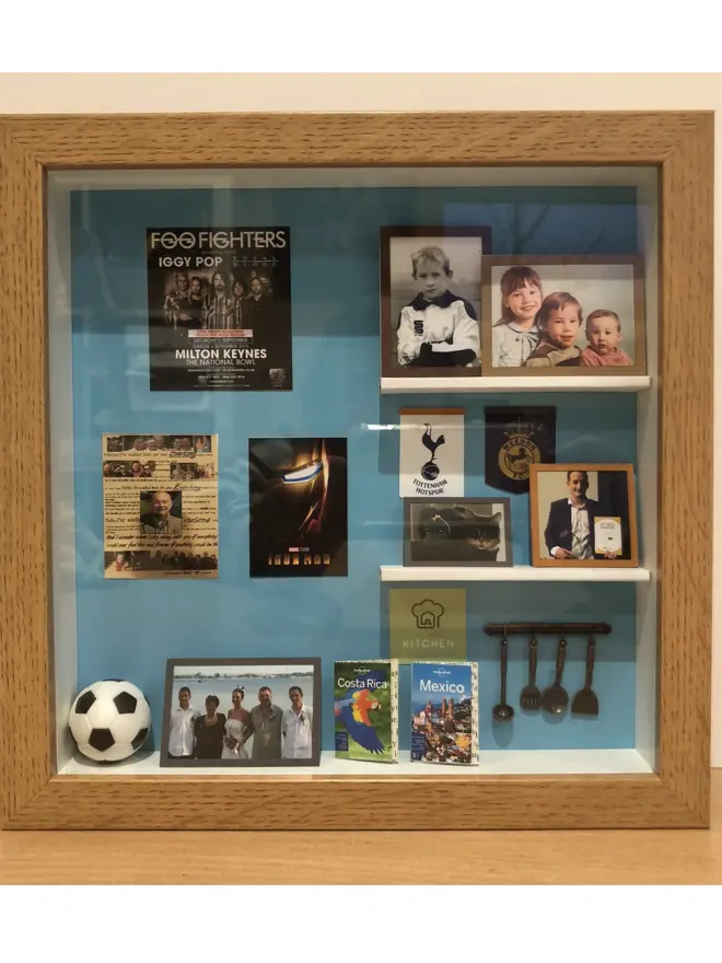 a wooden box with miniatures of the person favourite things inside. Each piece is handmade specially on request. bespoke art piece made by My Papercut Forest