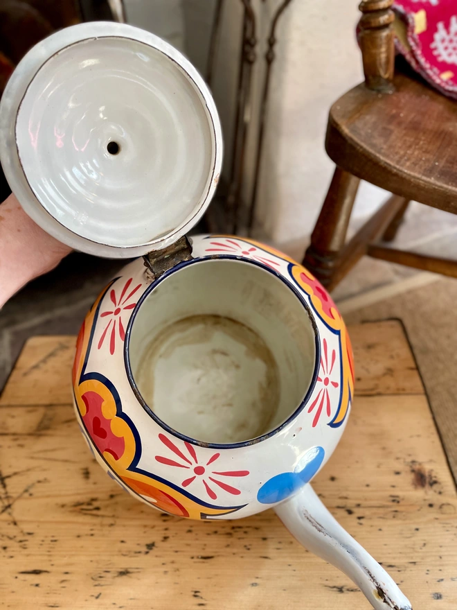 Inside of white vintage teapot. Some tea staining but still good condition.