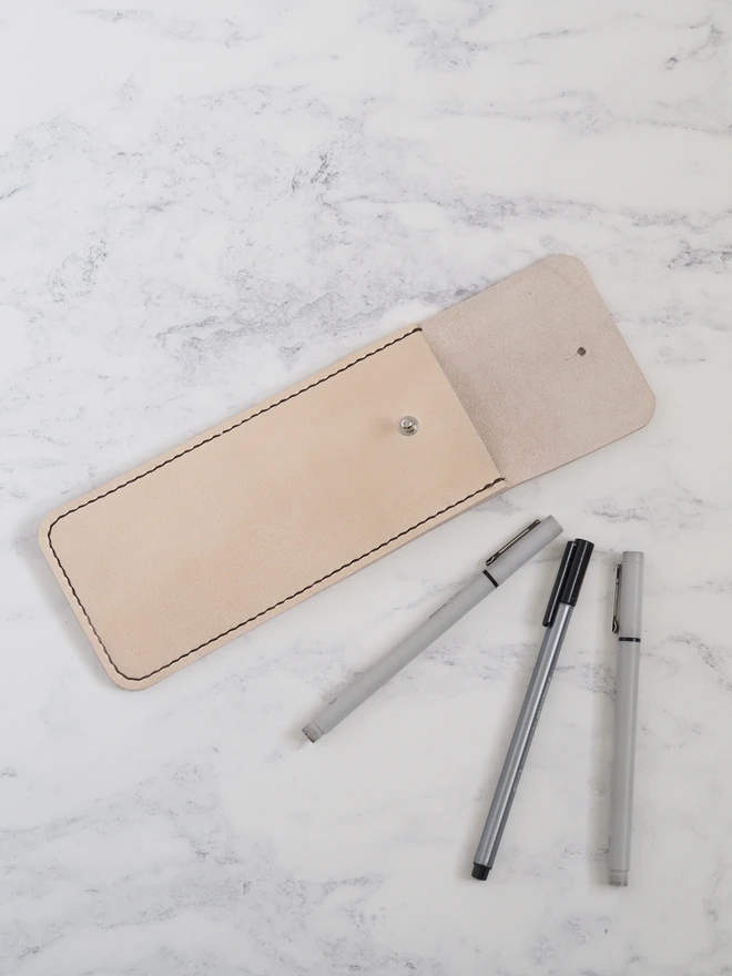 Handmade cream leather pencil sleeve.