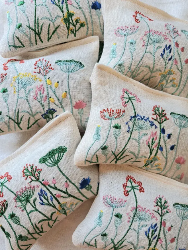 pile of Botanical themed embroidered Lavender Sachets