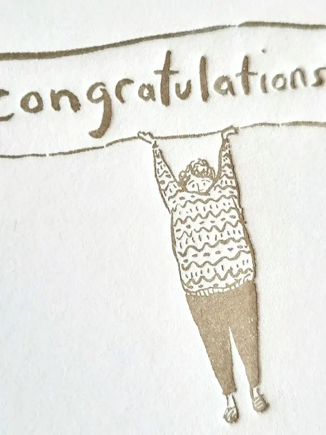 'Congratulations' Letterpress Handprinted Greetings Card, a white congratulations card with a golden design. 