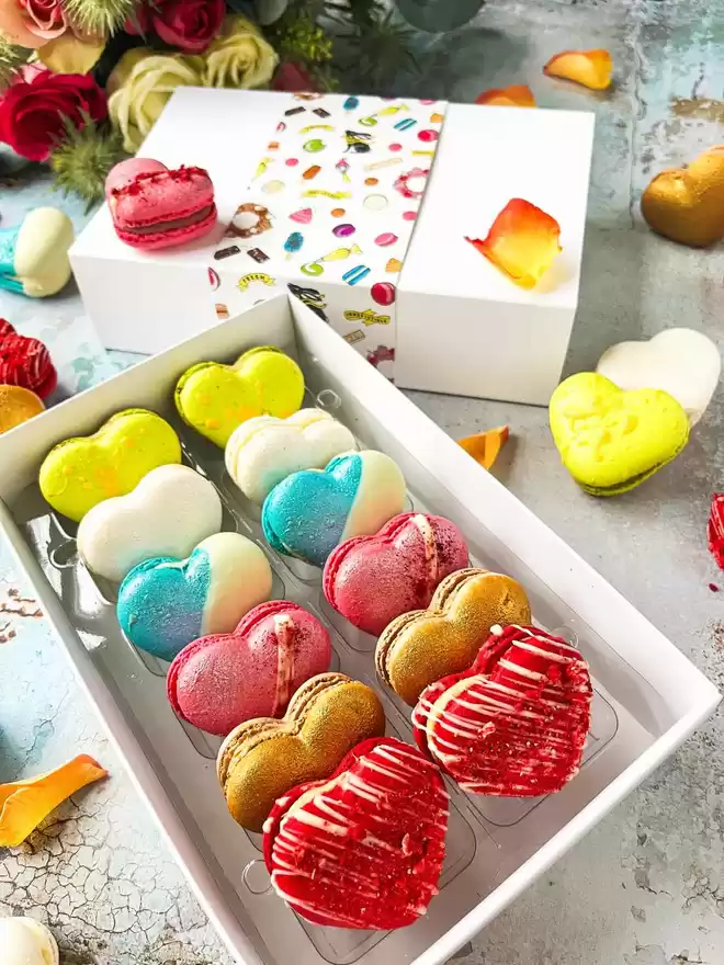 heart shaped macarons in a white box