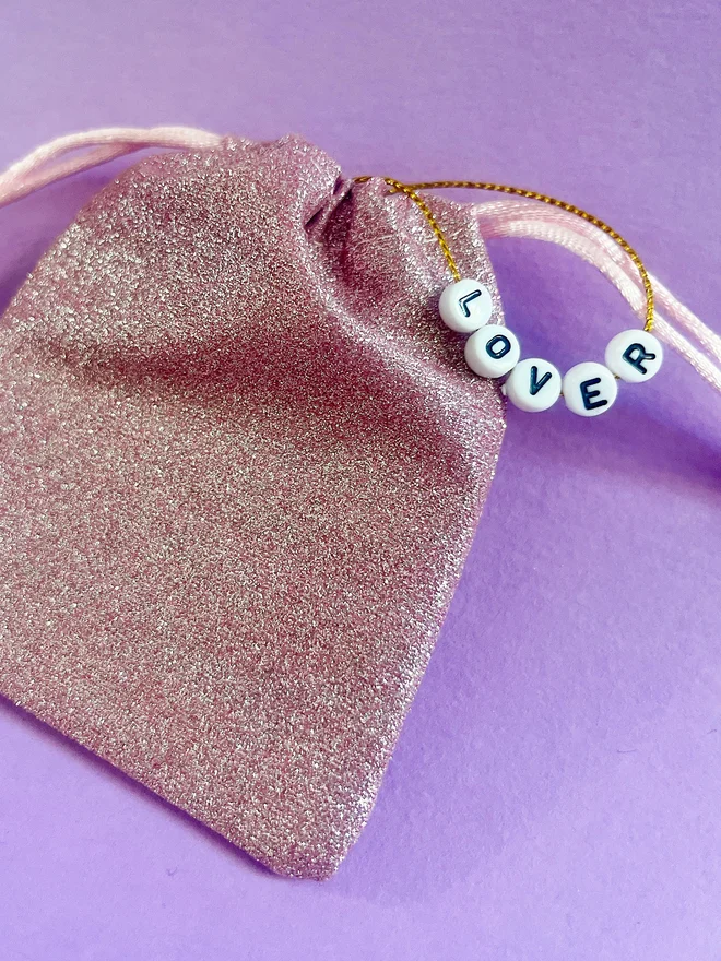 Glittery bag packaging for taylor swift ornament with beads