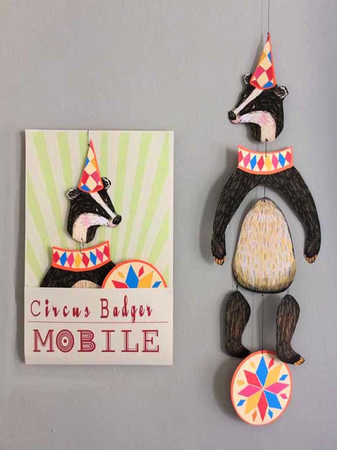 Badger mobile hanging alongside colourful packaging