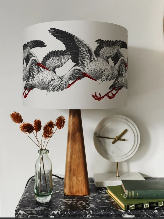 Elegant lampshade featuring elegant storks on a stylish, playful design.