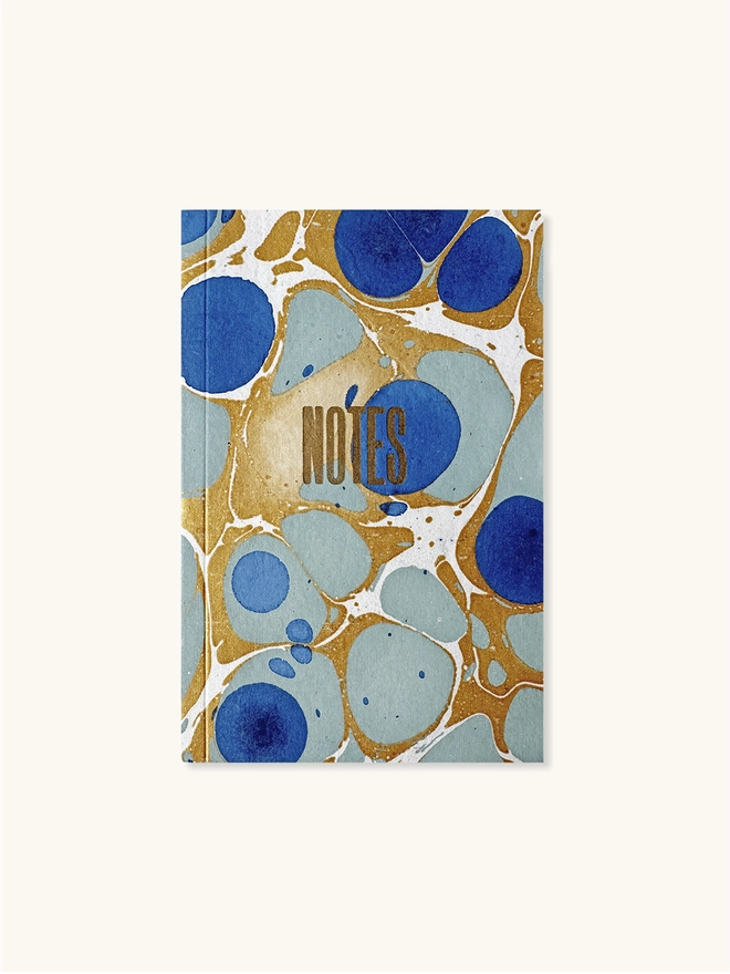 front of royal blue marbled notebook