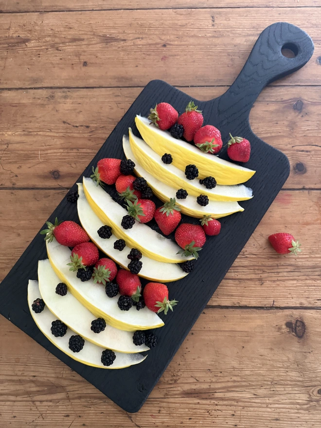 Round handled Yakisugi sharing board with fruit 