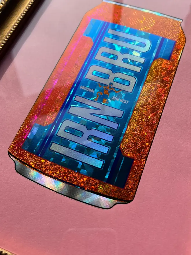 'Irn Bru' Can ScreenPrint, a colourful Irn Bru screenprint sitting framed against a colourful surface. 