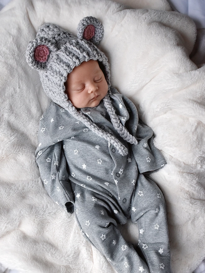 Newborn baby wearing handmade mouse hat