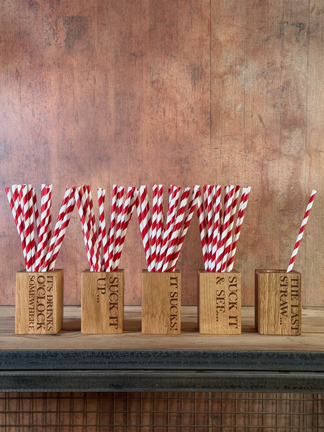 Stripy straws in a straw cup with engraving