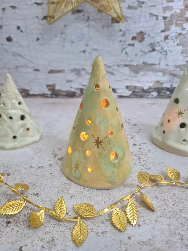 Ceramic christmas tree tea light holder, clay, pottery, Christmas decor, mantlepiece decor, christmas decoration, white with gold details, photographed with a gold star and gold leaves