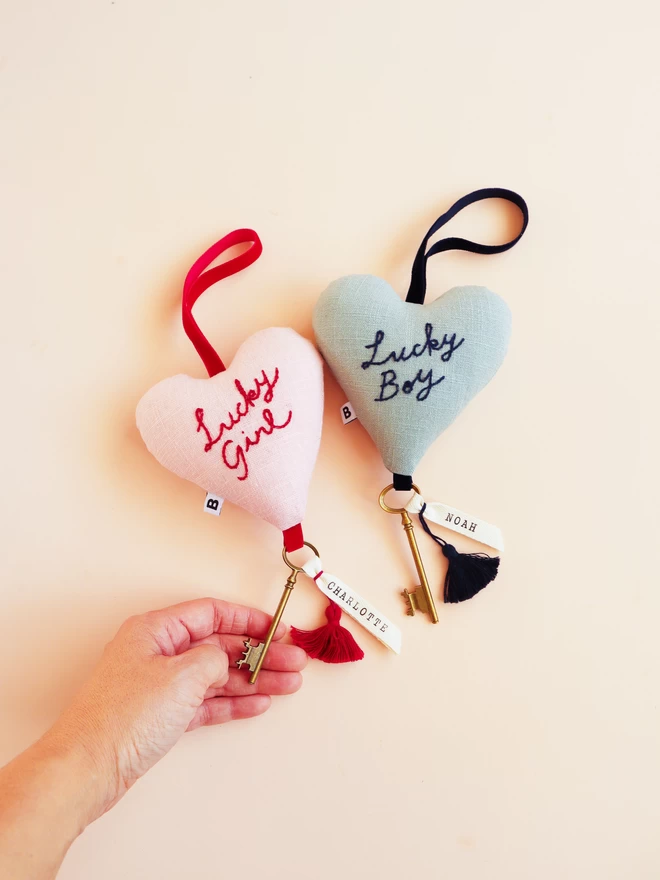 Linen heart shaped ornament with Lucky Girl or Boy embroidery,  velvet ribbon and antique key with a name. 