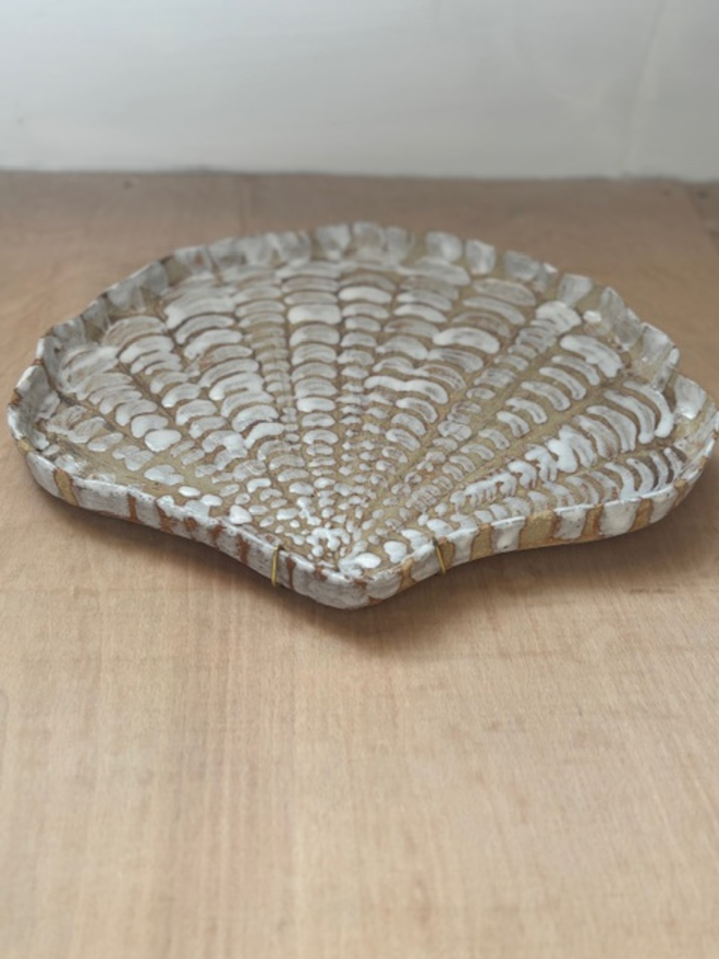 Ceramic shell plate
