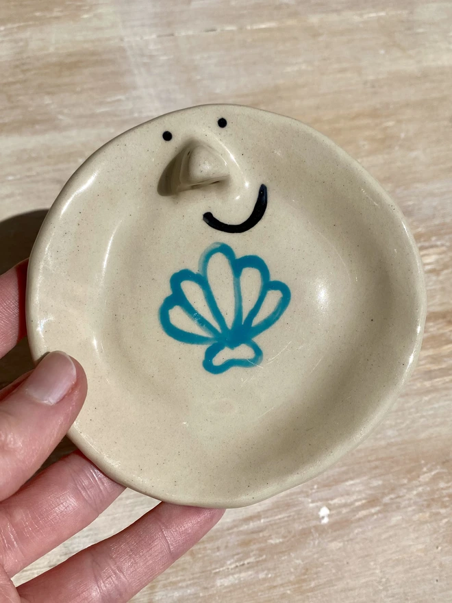 shell ceramic trinket tray - held - close up