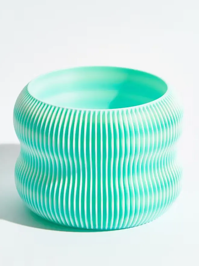 Sustainable 3D Printed Sky Blue Plant Pot, bubble design, against a white background.