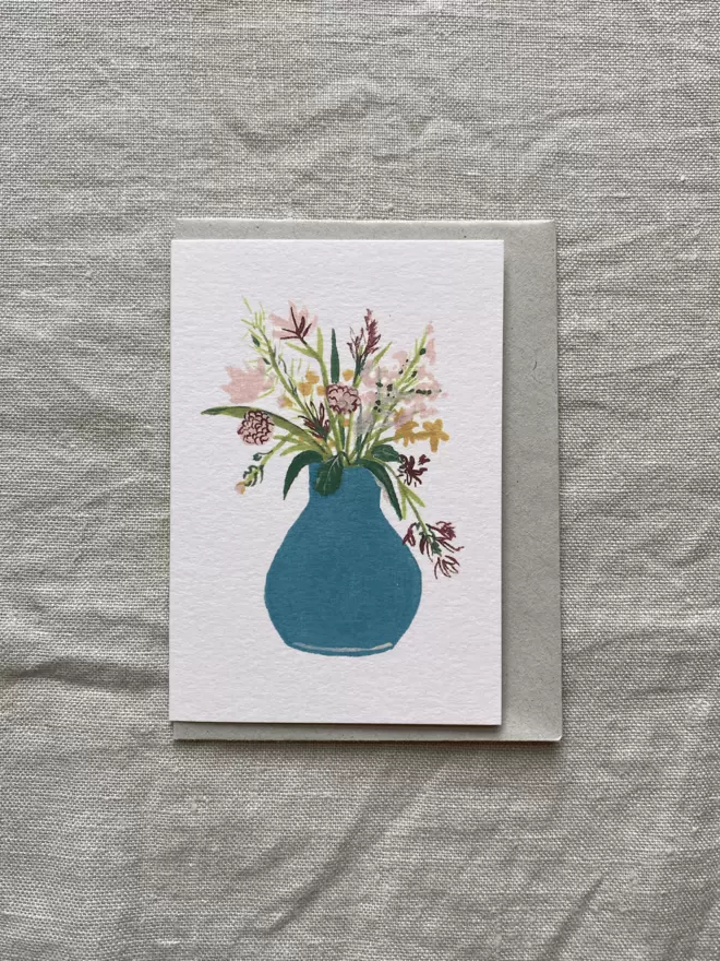 greeting card with mixed flower bunch in a blue vase 