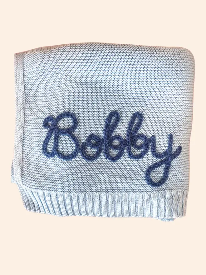 Hand-embroidered blue baby blanket