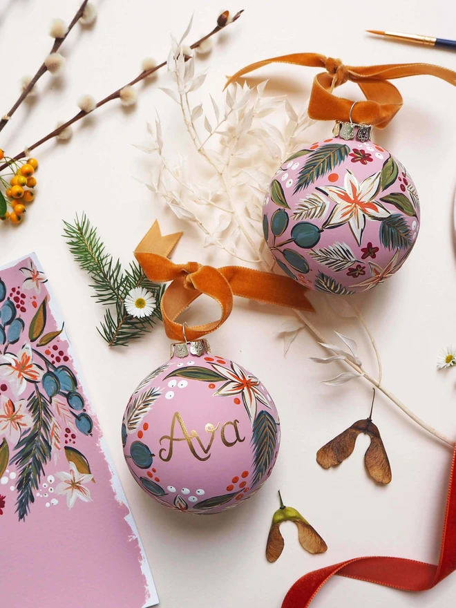 Pink handpainted bauble with floral details