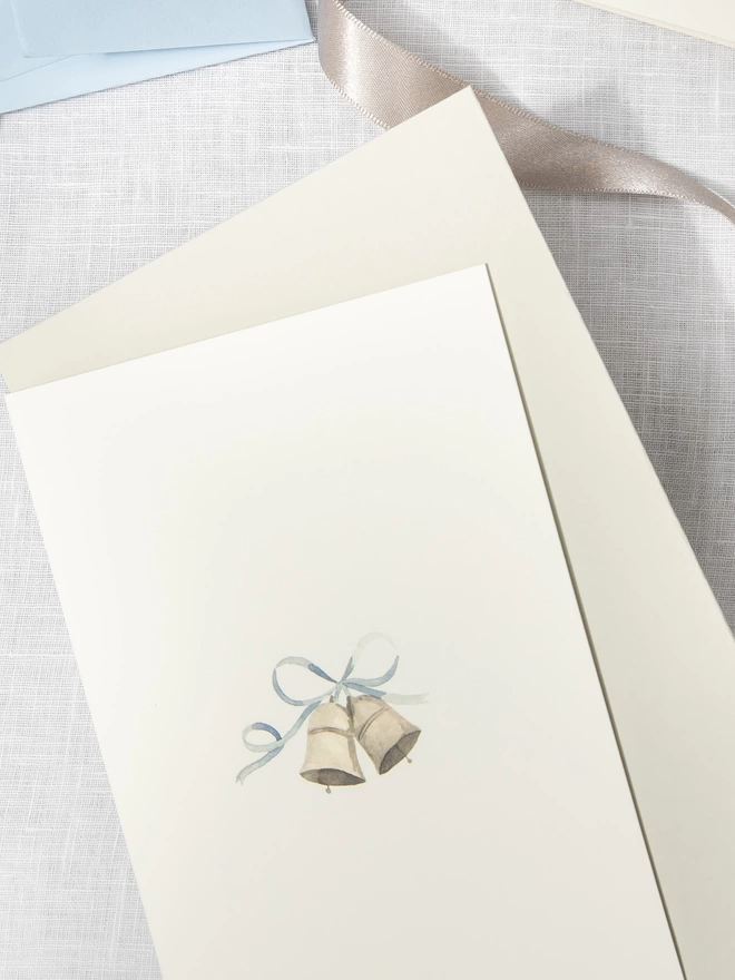 Greetings card with a watercolour illustration of a pair of wedding bells with a dove grey envelope