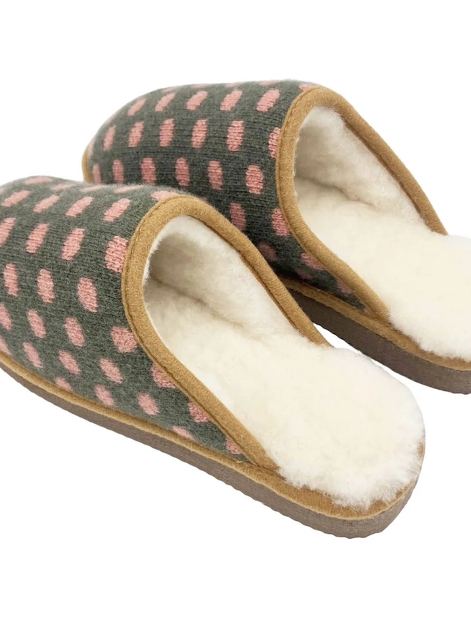 Lambswool & Sheepskin Slippers, a pair of colourful lambswool and sheepskin slippers sitting on a plain white surface. 