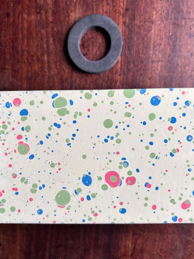 Matchbox Cover. A matchbox cover in O