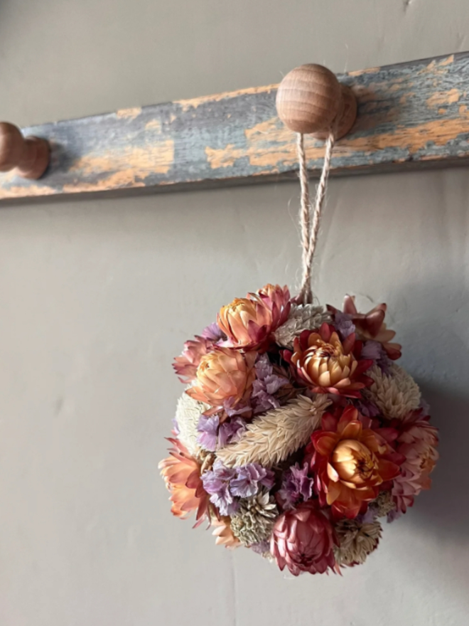 Sunset Dried Flower Bauble. A bauble made of dried seasonal flowers.