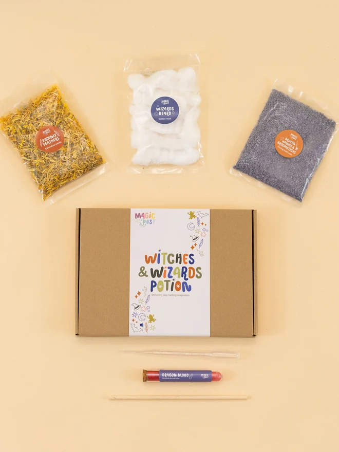 witches and wizards mini sensory potion kit. three bags of varied sensory ingredients placed around a cardboard box.