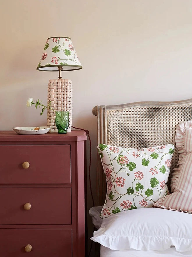 Geranium lampshade next to bedside 