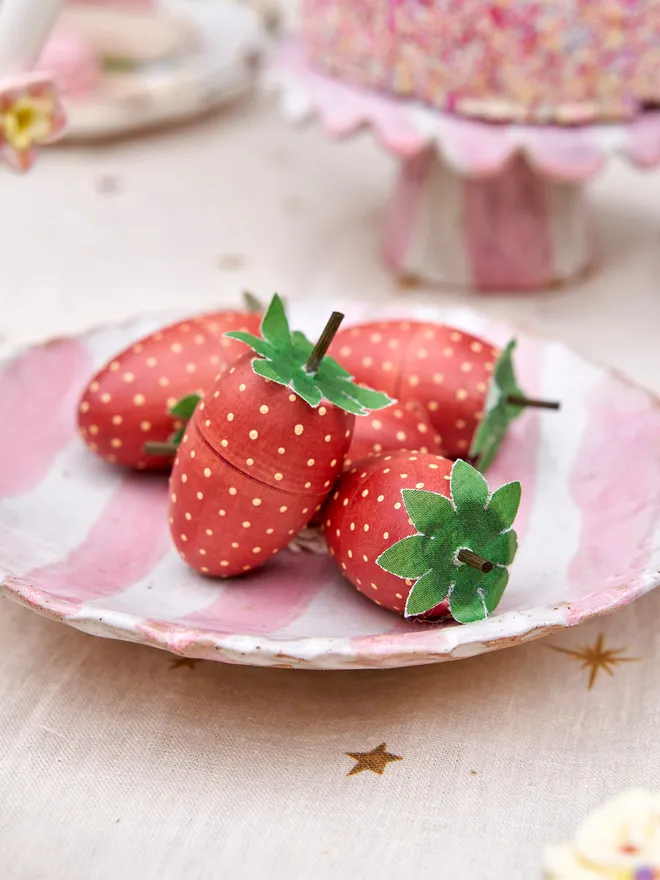 A punnet of wooden strawberries 