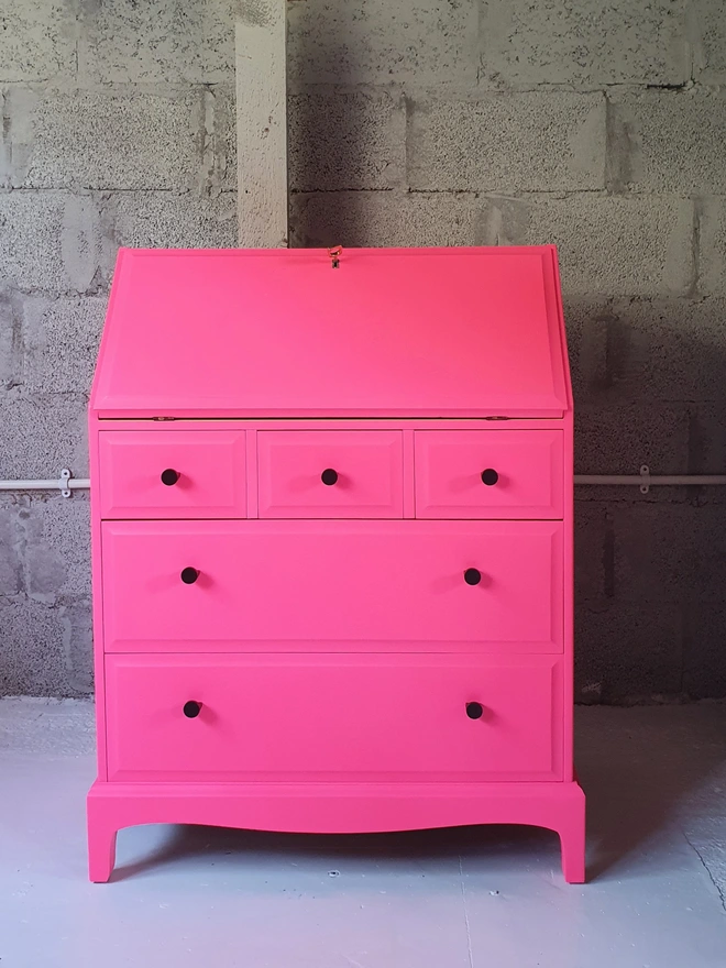 neon pink yellow bureau desk