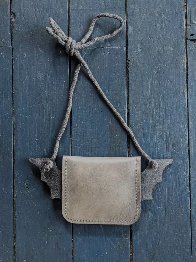 Back view of handmade leather Bat cross body purse.