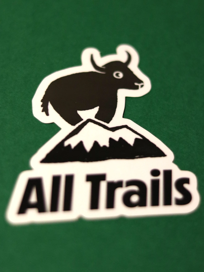 Sticker illustration of a yak on a mountain