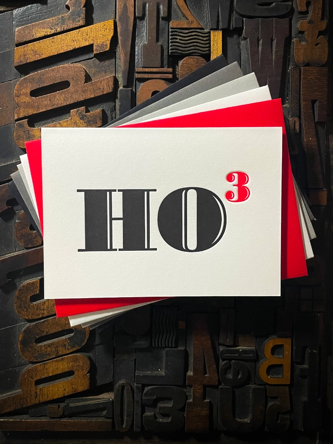 Ho Ho Ho! A beautiful typographic letterpress Christmas card. Printed in rich vibrant red and deep black inks with luxury matching and contrasting envelopes; ideal to send to your designer friends at the festive season.