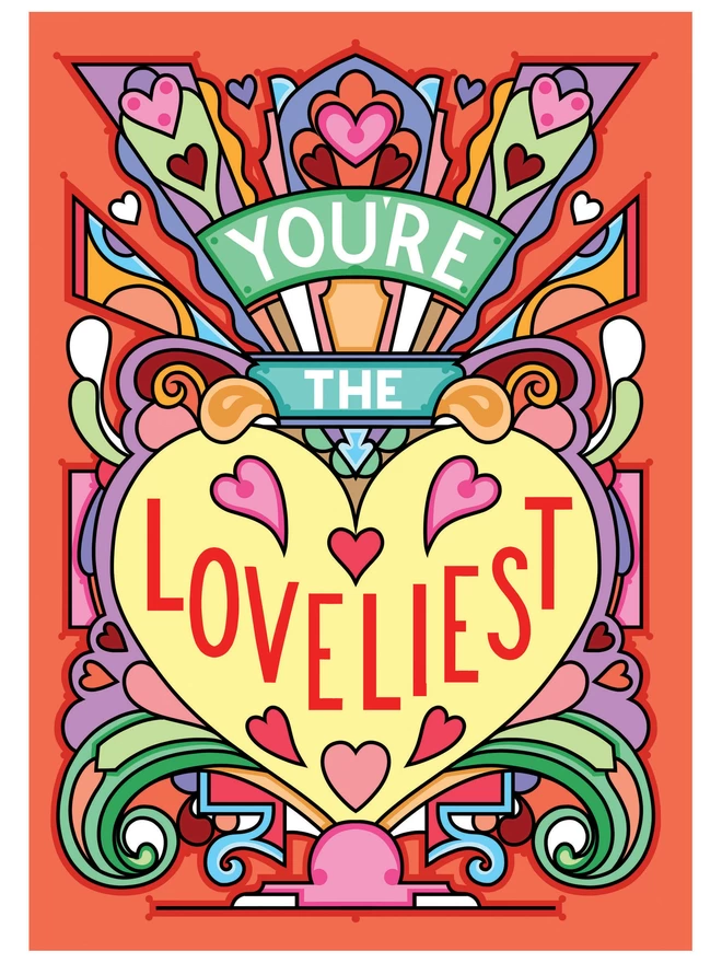 A greetings card with the phrase “You’re the Loveliest” surrounded by an abstract multi-coloured design and lots of hearts.