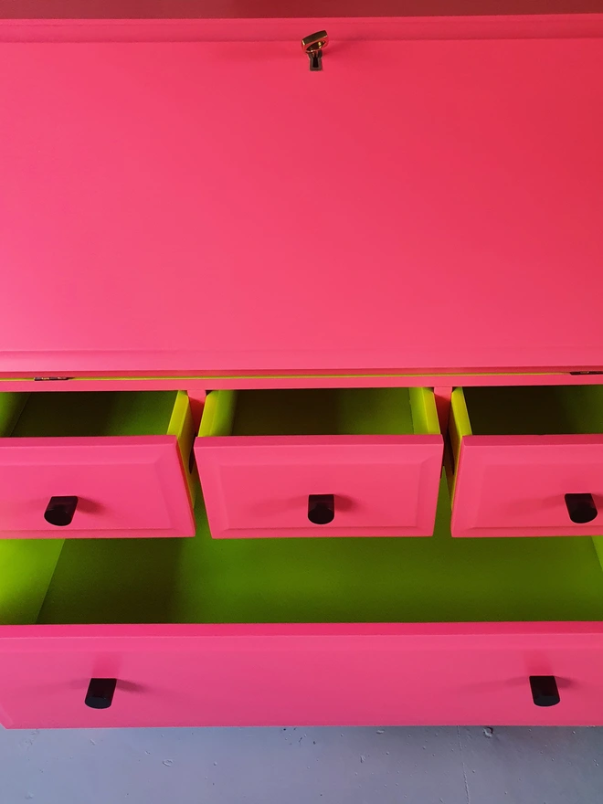 Neon pink bureau with neon yellow painted drawers