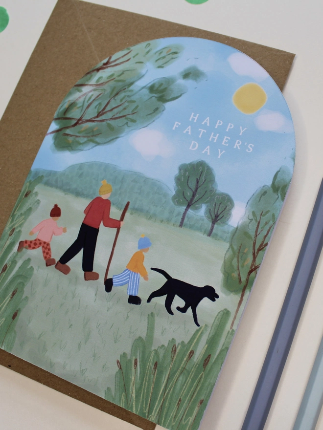 arch shape fathers day card featuring a family walk in nature