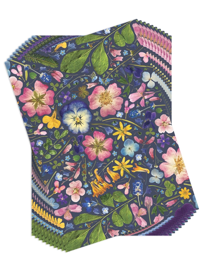 Set of 10 Folded wrapping paper sheets with a floral design created from pressed flowers.