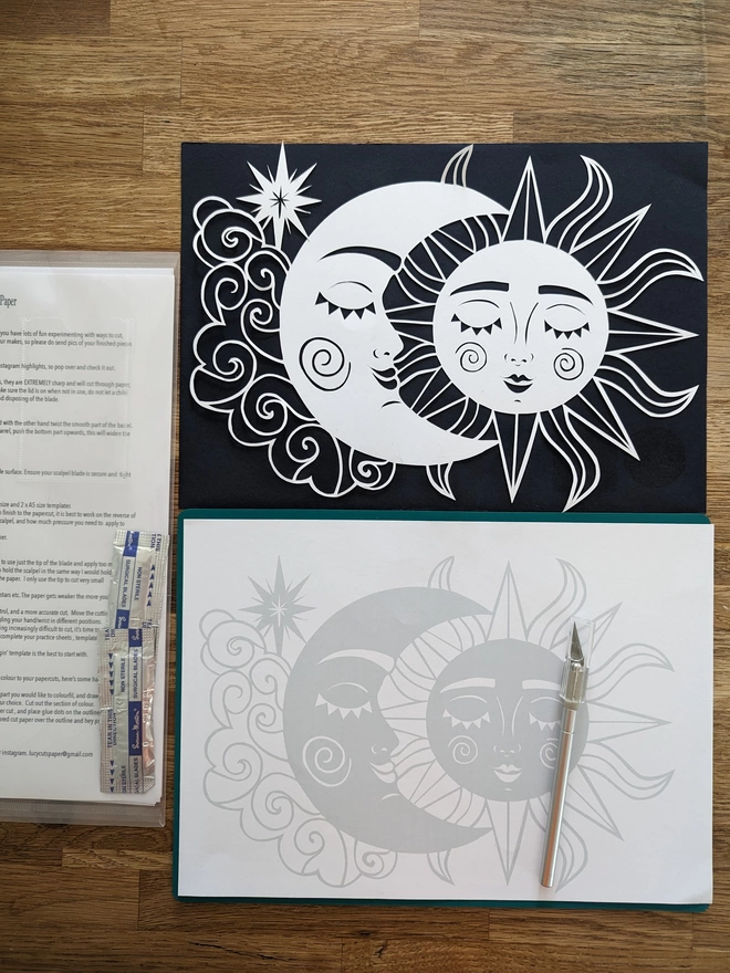 Template of sun and moon and completed papercut 